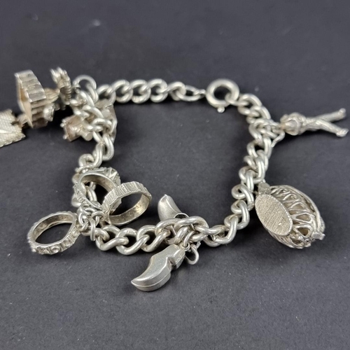 436 - Two bracelets, one with a padlock clap with twenty six attached charms and coins, some stamped 800 o... 