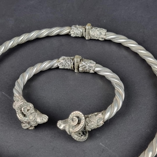 457 - A vintage Greek white metal Ram's head hinged bangle, the three dimensional Ram's heads having finel... 