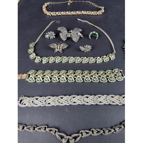 490 - A small quantity of silver marcasite jewellery; together with three simulated pearl necklaces; and o... 