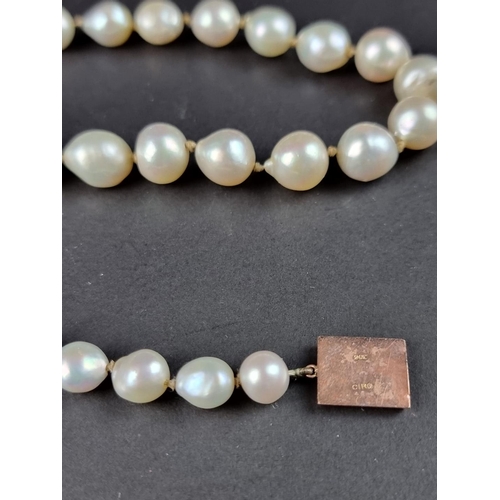 499 - A Ciro cultured pearl graduated necklace, the clasp stamped 9ct, 42cm; together with a similar pair ... 