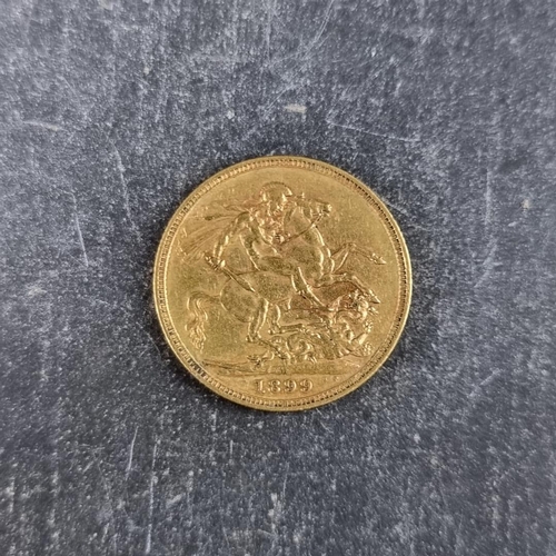 516 - Coins: a Victoria 1899 gold sovereign, Melbourne mint.