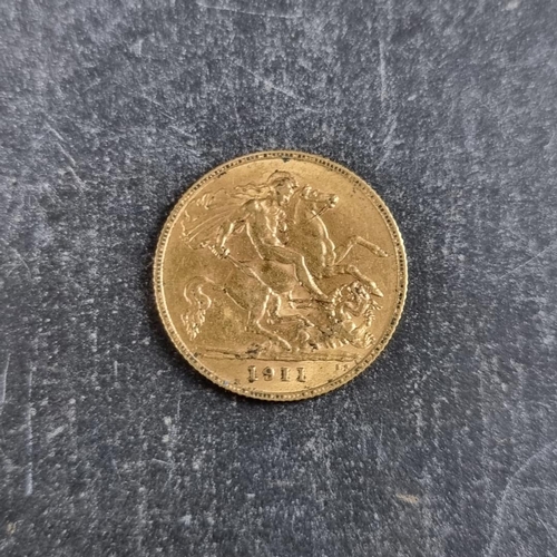 517 - Coins: a George V 1911 gold half sovereign.