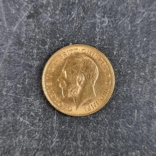 518 - Coins: a George V 1913 gold half sovereign.