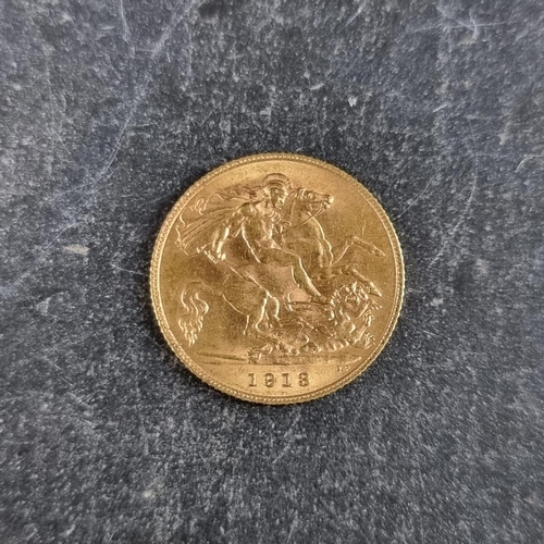 518 - Coins: a George V 1913 gold half sovereign.