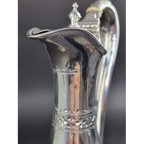 52 - A Victorian silver claret jug, by Martin, Hall & Co, Sheffield 1868, having ivory insulators, he... 