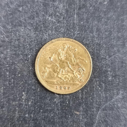 520 - Coins: a Victoria 1897 gold half sovereign.