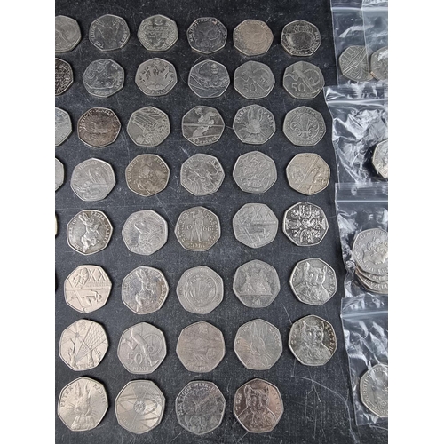 538 - Coins: approximately 130 collectable 50p coins; together with two Charles III 50p coins.... 