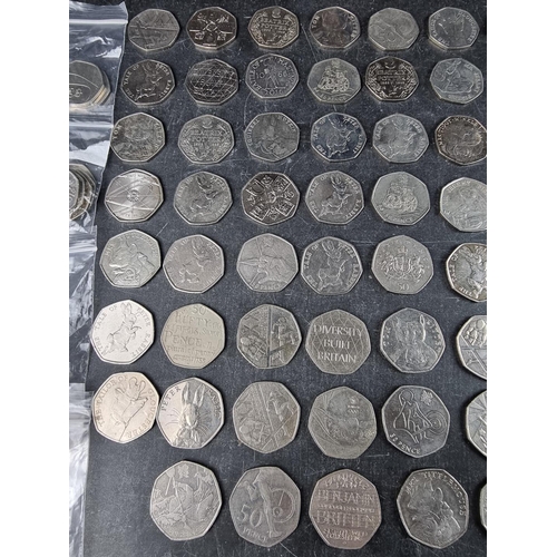 538 - Coins: approximately 130 collectable 50p coins; together with two Charles III 50p coins.... 