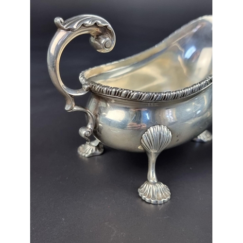 6 - A pair of silver sauce boats, by C S Harris & Sons Ltd, London 1912, height to handles 10cm... 