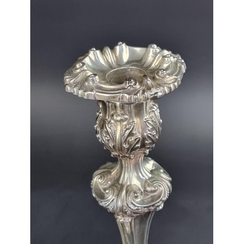 63 - A pair of William IV silver candlesticks, I.W, Sheffield 1834 and 1837, 28cm high, weighted.... 