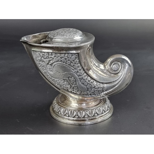 66 - A Persian white metal nautilus shell spoon warmer, 11.5cm high.