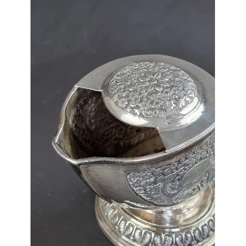 66 - A Persian white metal nautilus shell spoon warmer, 11.5cm high.