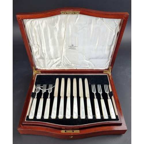 67 - A cased set of twelve silver and mother-of-pearl fruit knives and forks, by Mappin & Webb Ltd, L... 