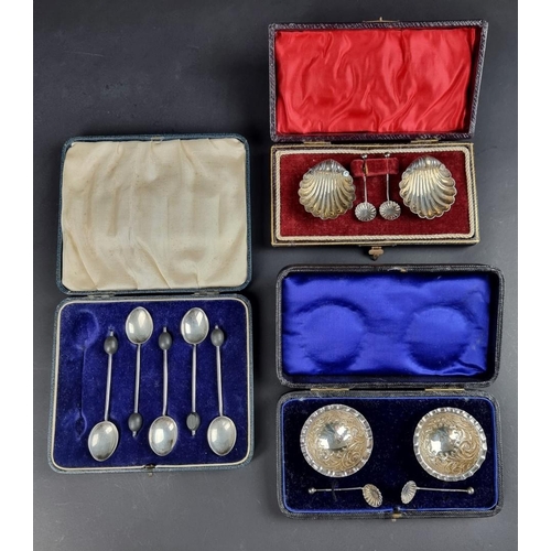 67A - A cased pair of Victorian silver salts and spoons, by Henry Williamson Ltd, Birmingham 1900; togethe... 