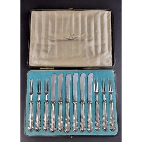 68 - A cased set of twelve silver handled fruit knives and forks, by Walker & Hall, Sheffield, forks ... 