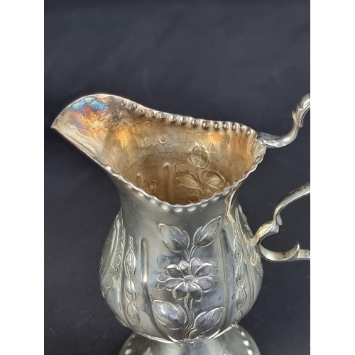 9 - A George III cream jug, maker's mark rubbed, London 1776, (having later decoration), height to handl... 