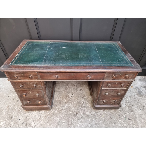 1006 - A circa 1900 oak pedestal desk, 138cm wide.