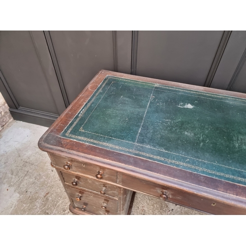 1006 - A circa 1900 oak pedestal desk, 138cm wide.