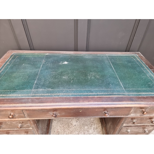 1006 - A circa 1900 oak pedestal desk, 138cm wide.