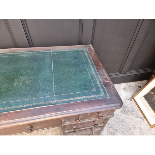 1006 - A circa 1900 oak pedestal desk, 138cm wide.