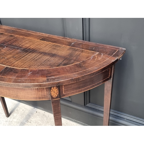 1015 - A small antique mahogany and inlaid demi-lune console table, 81.5cm wide.