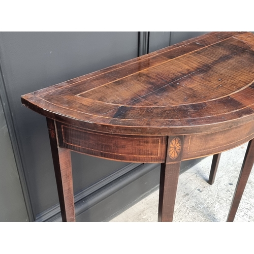 1015 - A small antique mahogany and inlaid demi-lune console table, 81.5cm wide.