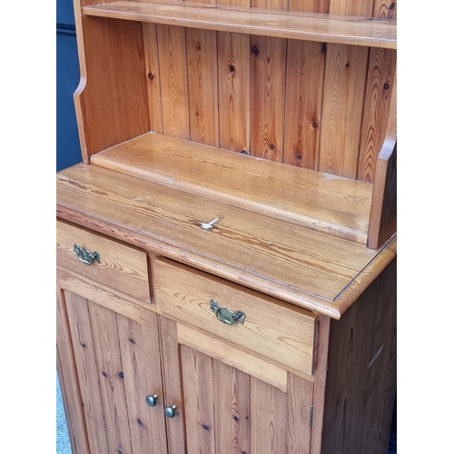 1016 - A narrow pine bookcase, 78.5cm wide.