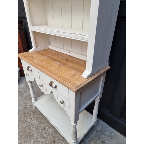 1017 - A small white painted pine dresser and rack, 96.5cm wide.