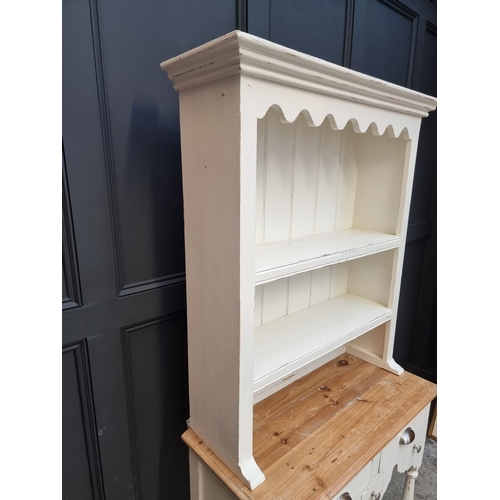 1017 - A small white painted pine dresser and rack, 96.5cm wide.