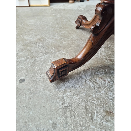 1023 - A Victorian walnut octagonal centre table, with well figured quarter veneered top, 99cm wide.... 