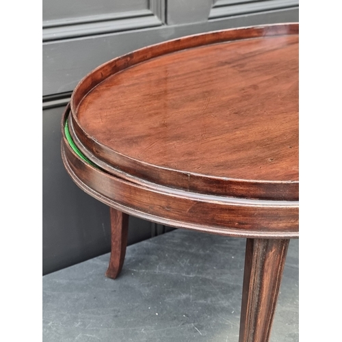 1027 - A 19th century mahogany oval gallery tray, 72.5cm wide, on later conforming stand.