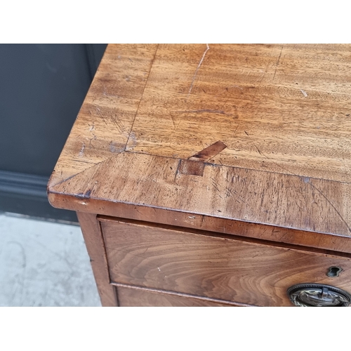 1031 - An early 19th century mahogany and crossbanded chest of drawers, 100.5cm wide.