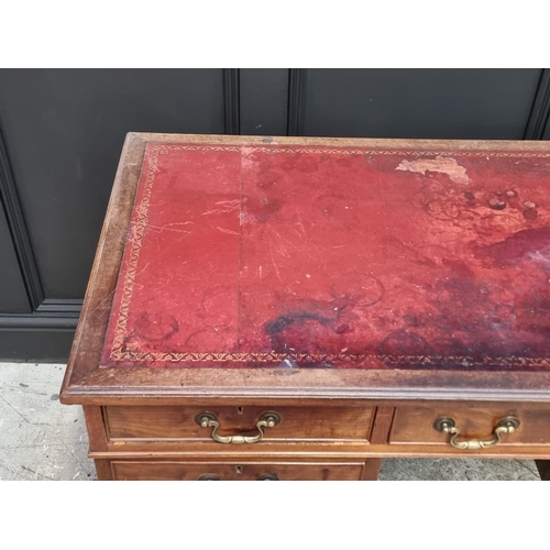 1034 - A circa 1900 walnut pedestal desk, 130cm wide.