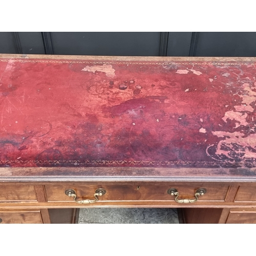 1034 - A circa 1900 walnut pedestal desk, 130cm wide.