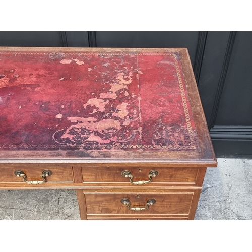 1034 - A circa 1900 walnut pedestal desk, 130cm wide.