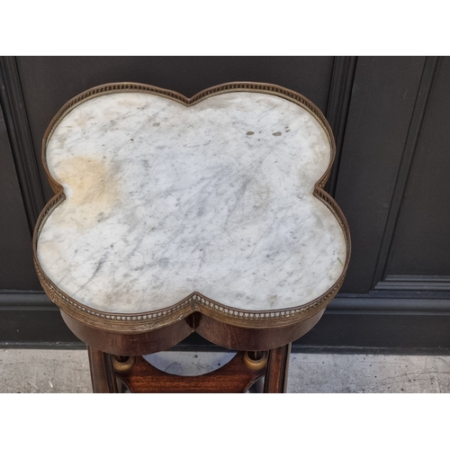 1035 - A stained beech and marble top quatrefoil table, with brass mounts, 40cm wide.