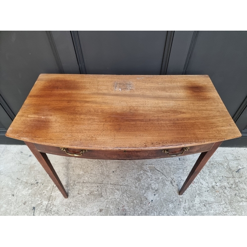 1037 - A late George III mahogany and boxwood strung bowfront side table, 92cm wide.