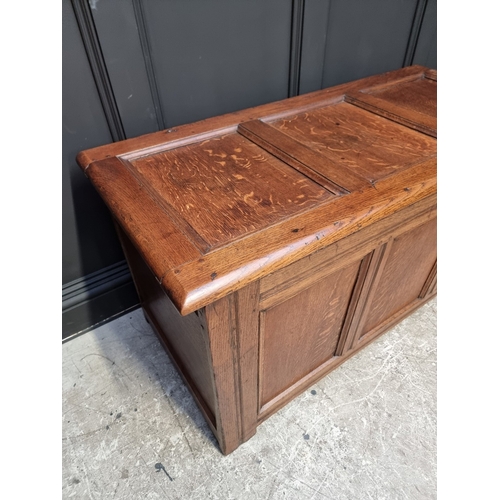 1040 - A late 17th century oak panelled coffer, 126cm wide.