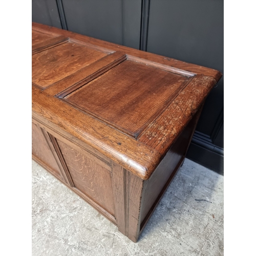 1040 - A late 17th century oak panelled coffer, 126cm wide.