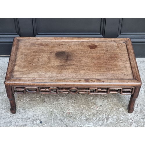 1041 - A Chinese hardwood low occasional table, with pierced frieze, 77cm wide.