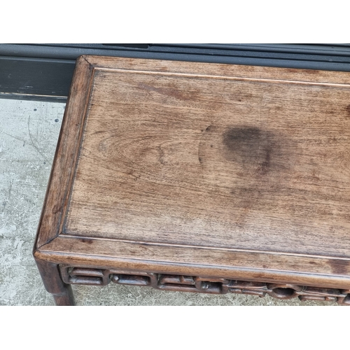 1041 - A Chinese hardwood low occasional table, with pierced frieze, 77cm wide.