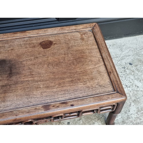 1041 - A Chinese hardwood low occasional table, with pierced frieze, 77cm wide.