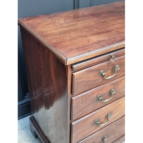 1042 - A George III mahogany chest of drawers, with brushing slide, 91cm wide.