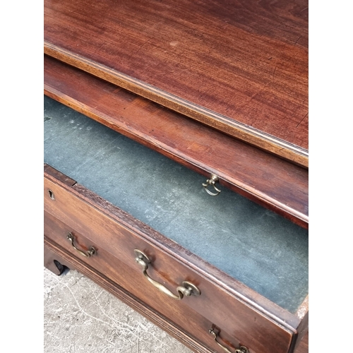 1042 - A George III mahogany chest of drawers, with brushing slide, 91cm wide.