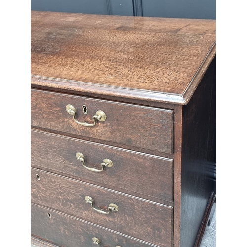 1043 - A George III oak chest of drawers, 101.5cm wide.