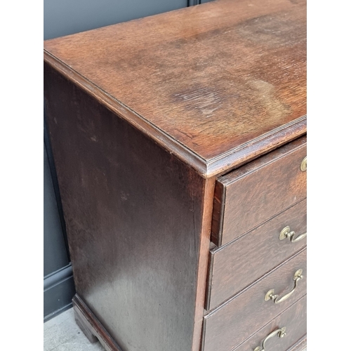 1043 - A George III oak chest of drawers, 101.5cm wide.