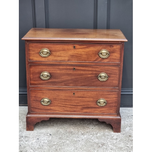 1045 - An early 19th century mahogany three drawer chest, 85.5cm wide.