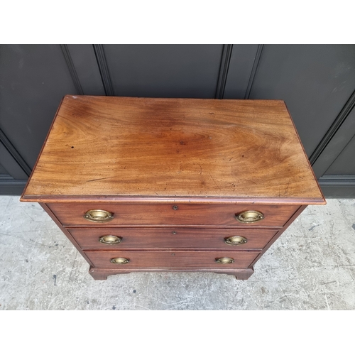 1045 - An early 19th century mahogany three drawer chest, 85.5cm wide.