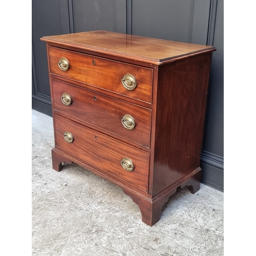 1045 - An early 19th century mahogany three drawer chest, 85.5cm wide.