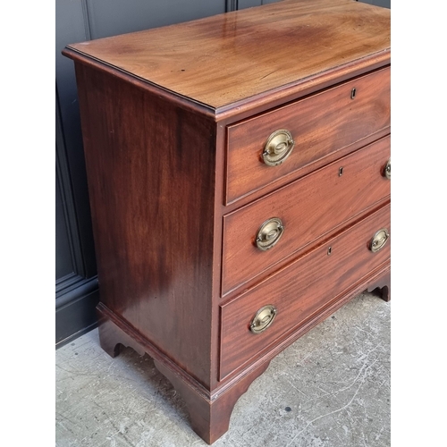 1045 - An early 19th century mahogany three drawer chest, 85.5cm wide.